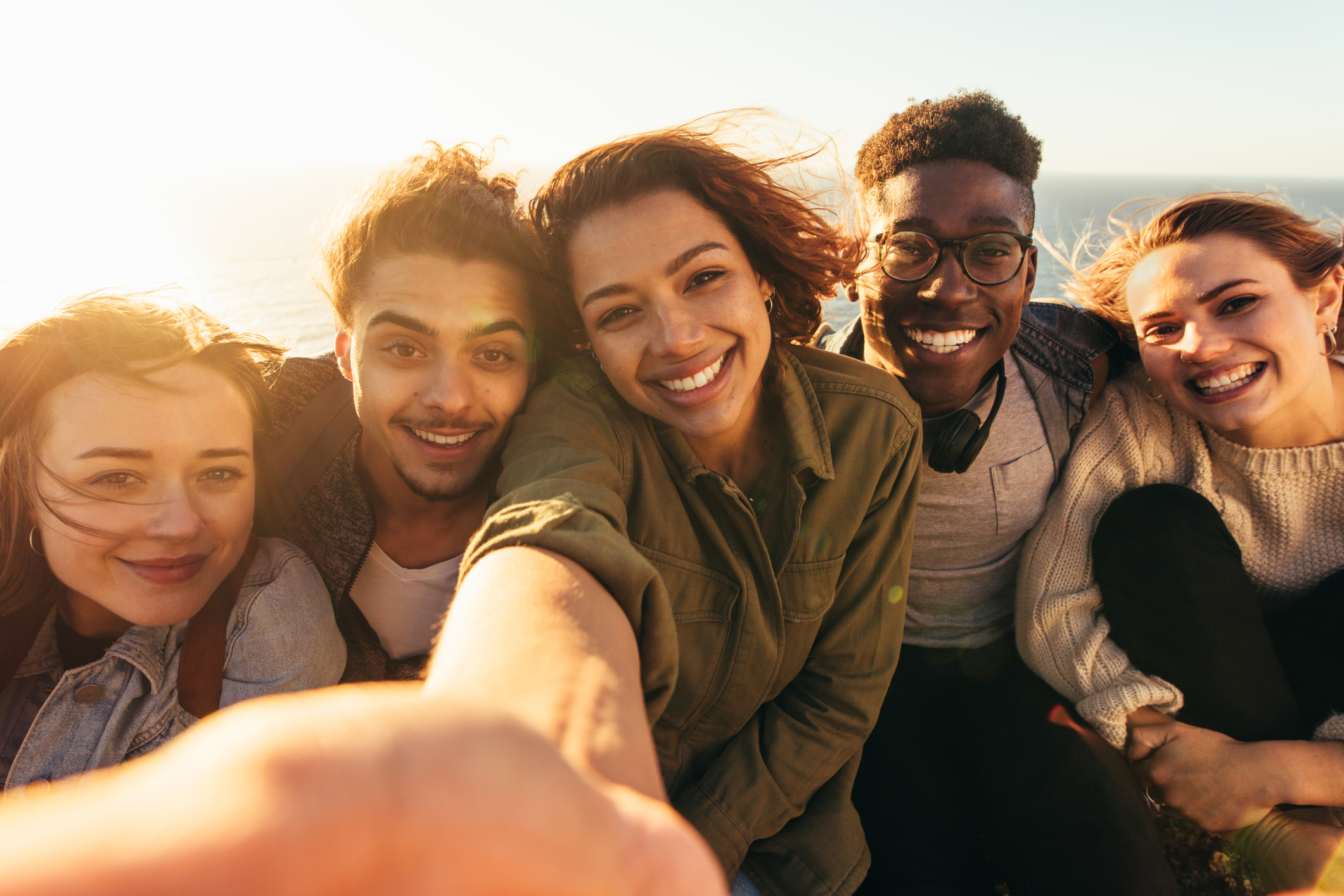 Cheerful friends taking selfie on a holiday