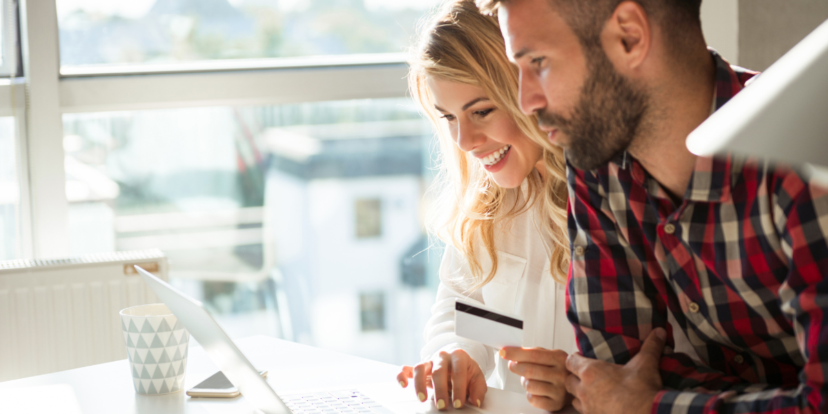 A couple happily buying things online