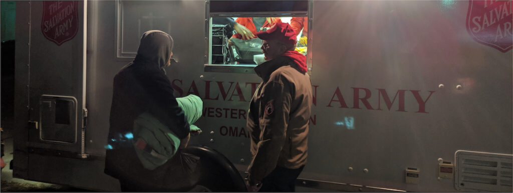 Salvation army truck handing out winter items