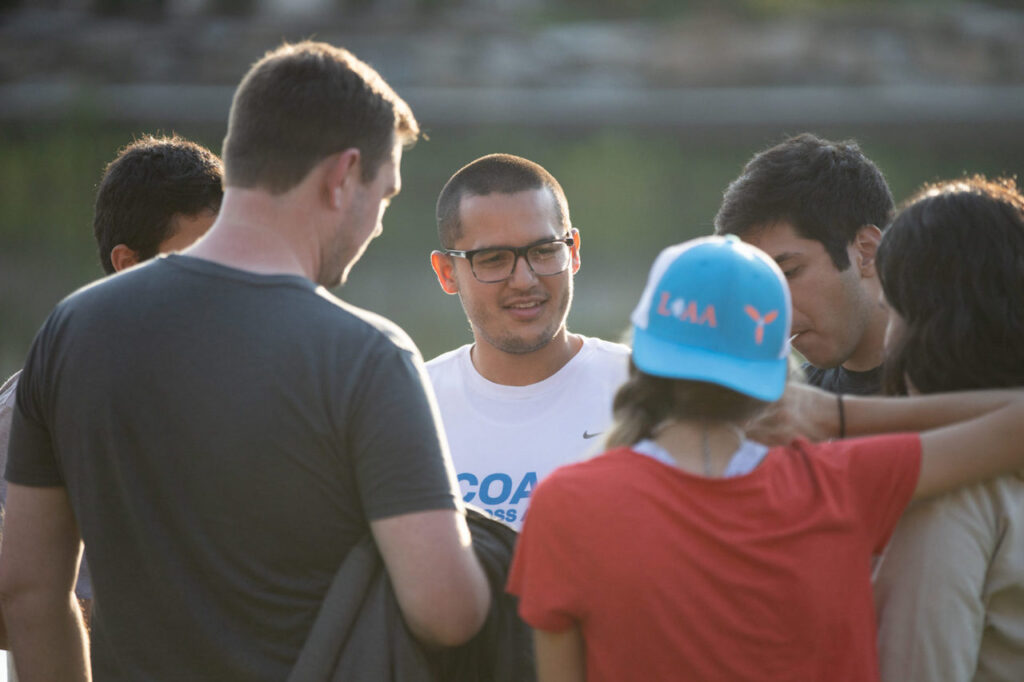 A man with a group of young people